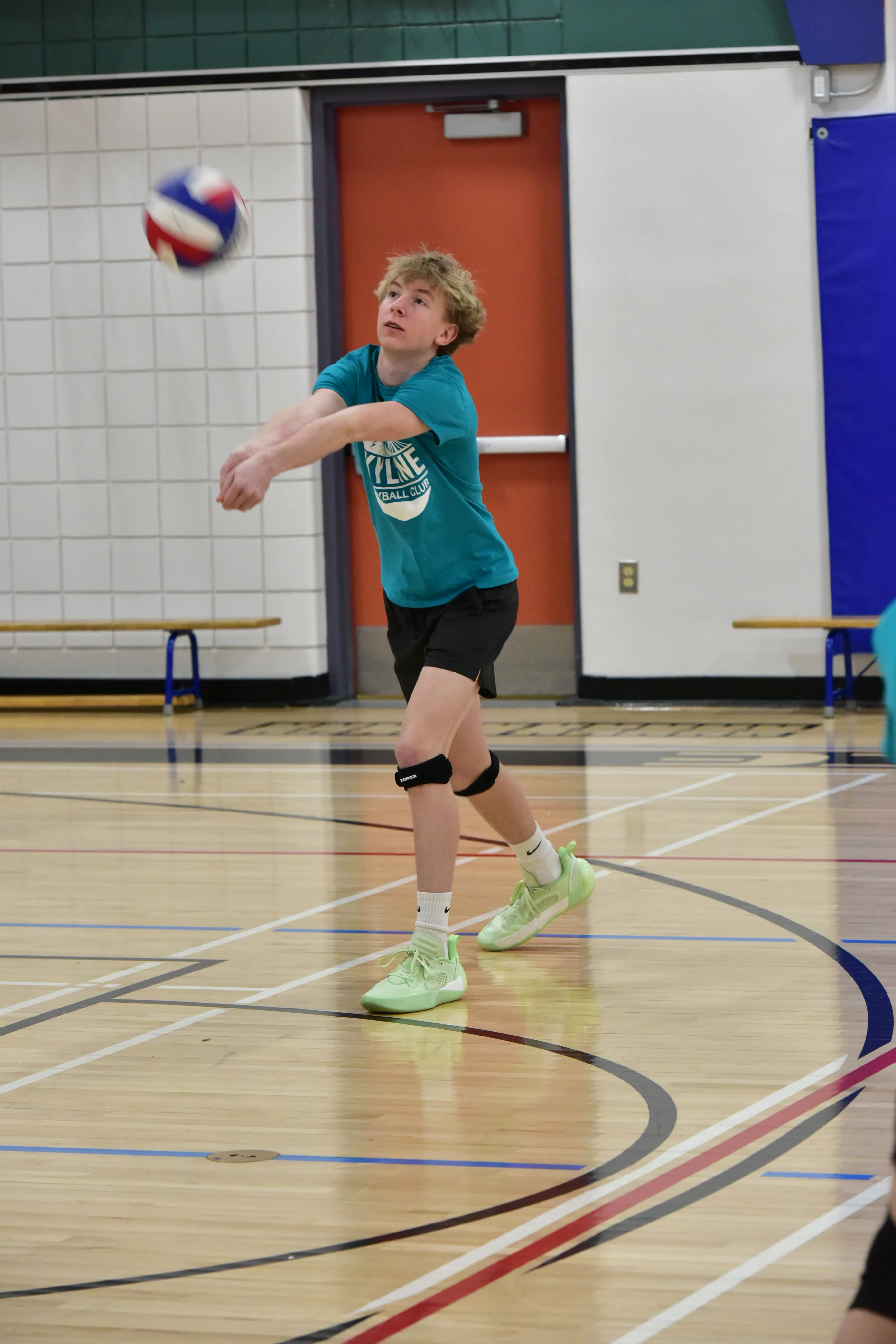 Sky Volleyball coach guiding athletes during a training session