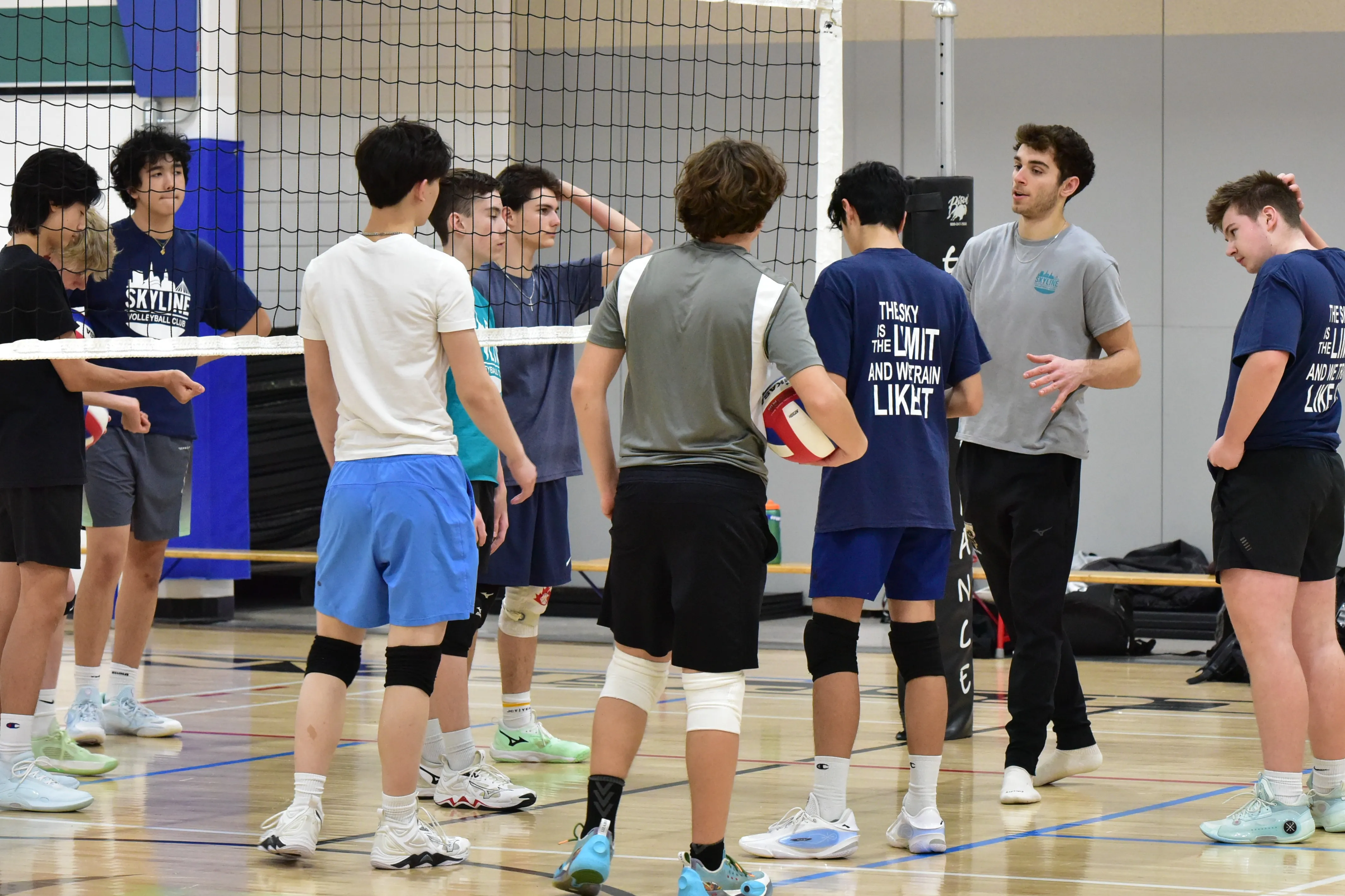 Youth athlete setting a volleyball during practice