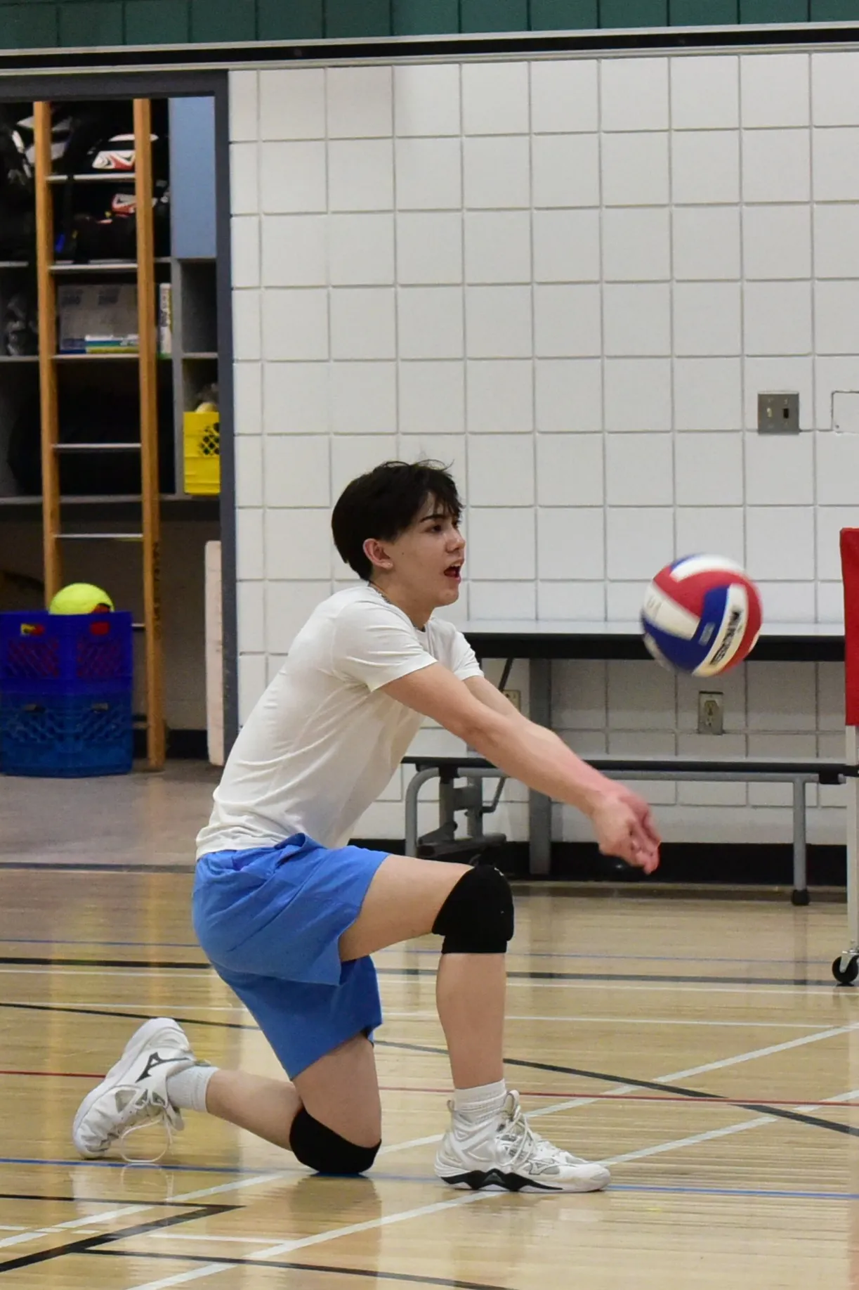 Volleyball player receiving feedback during assessment