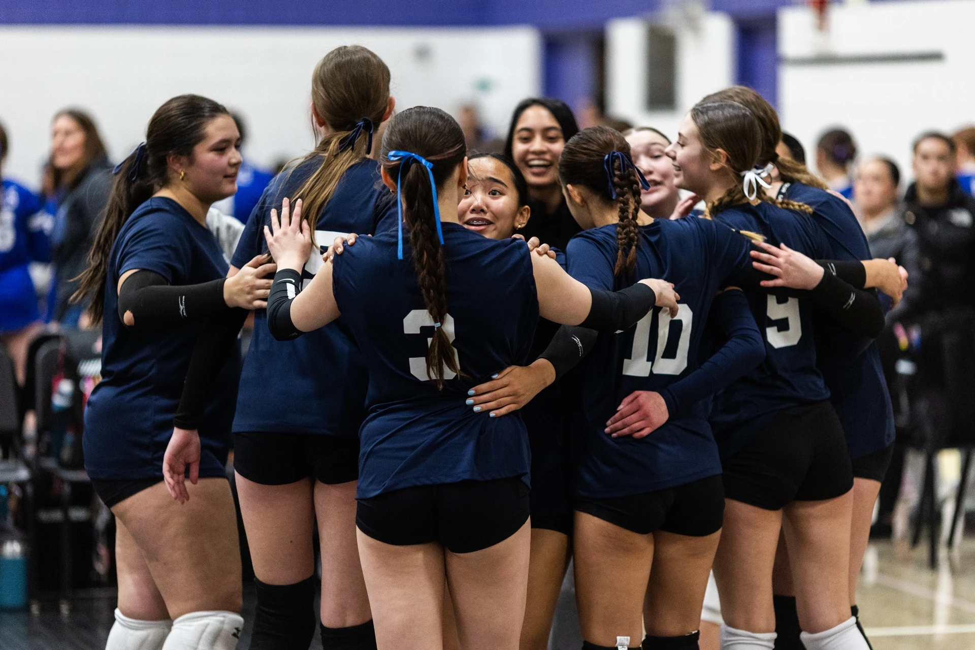 Athletes at the net during a volleyball session