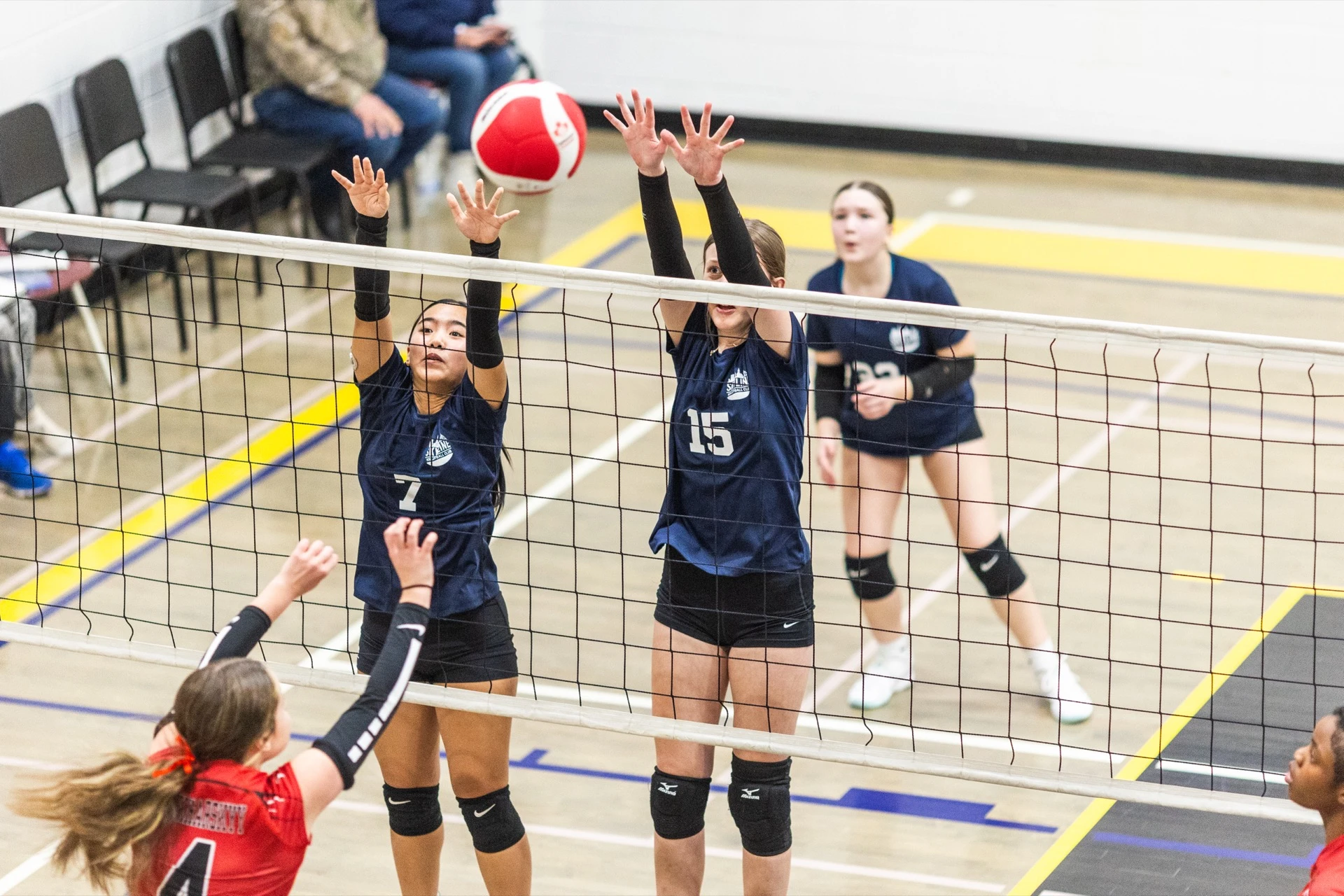 Skyline athletes competing at a volleyball tournament