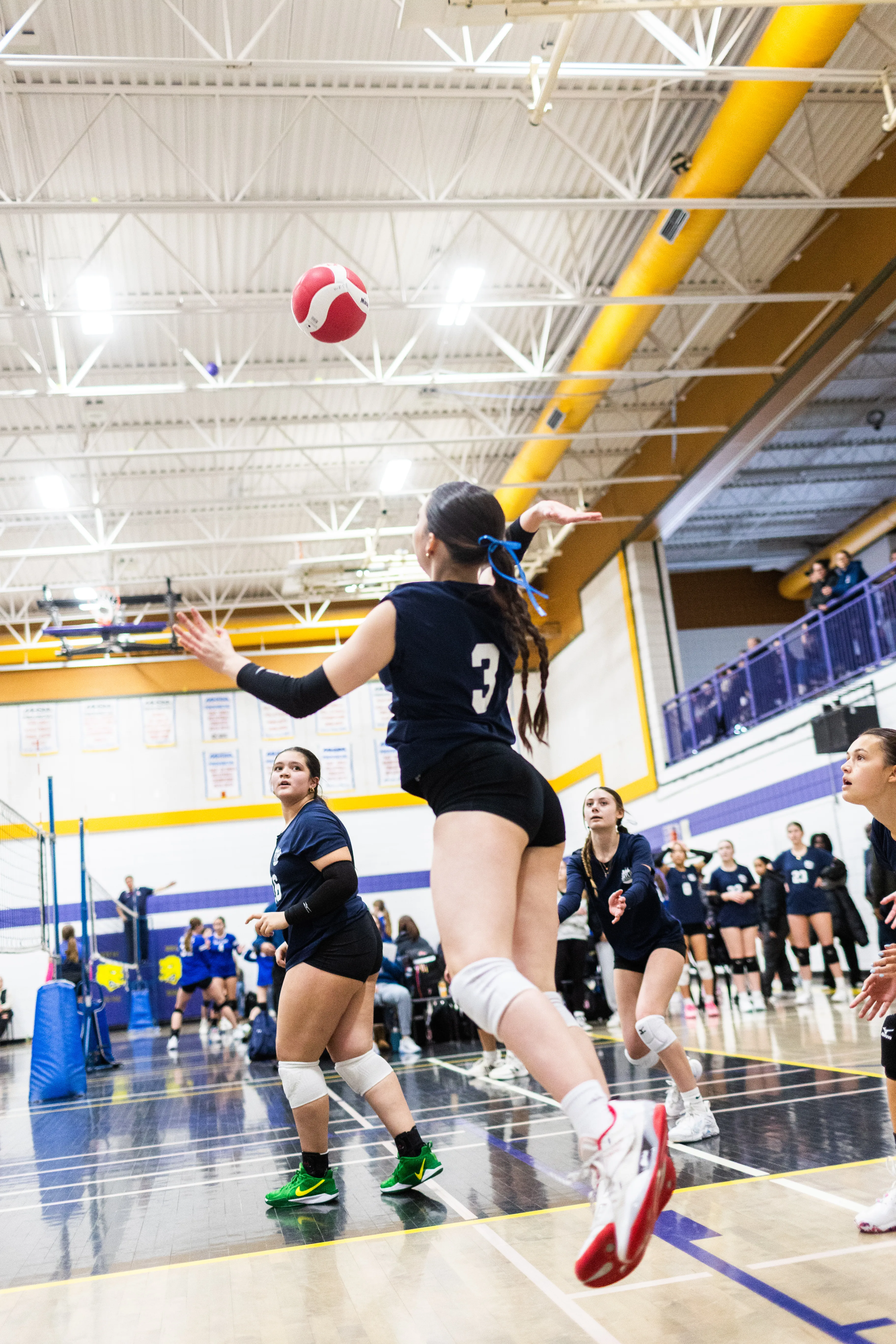 Athlete hitting at the net during a competitive match
